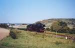 Die 03 1010-2 vom DB Museum mit einem leeren Winzerfestsonderzug von Freyburg in die Abstellung nach Naumburg Hbf, am 12.09.1999 bei Ni�mitz.