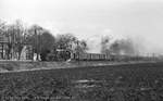 DR 52 8148 mit einem Güterzug von Sangerhausen nach Karsdorf, am 13.03.1982 in Reinsdorf bei Artern.