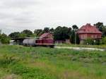 LEG 202 484-2 mit einem Kesselwagen auf der Fahrt von Karsdorf (Zementwerk) nach Bad Schandau (�ber Naumburg Ost), am 03.07.2012 im Bf Laucha.